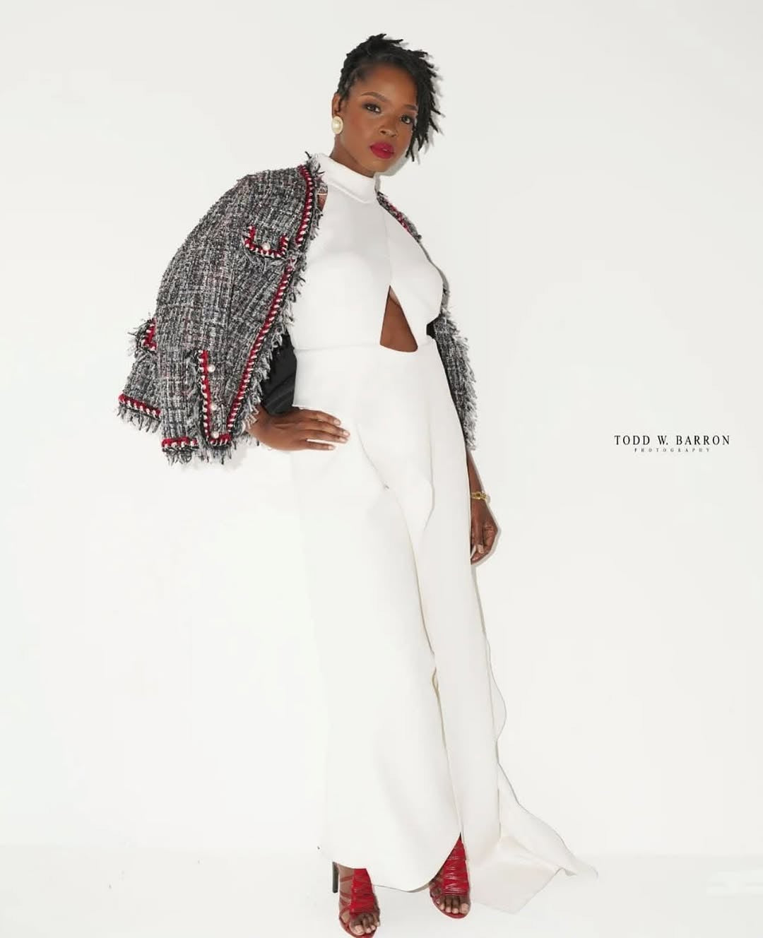 Fashion model in a white editorial look demonstrating confident personal-brand presence