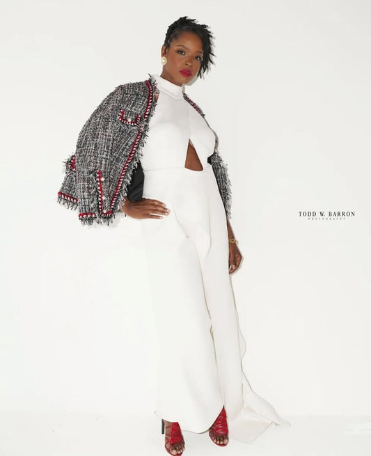 Fashion model in a white editorial look demonstrating confident personal-brand presence